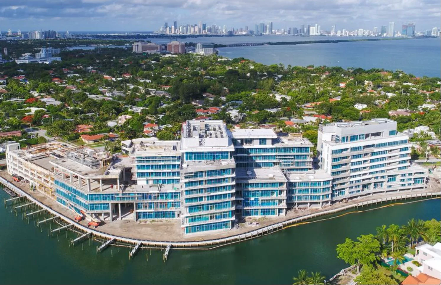 Ritz-Carlton Residences Miami — aerial view of waterfront residences with blue-tinted glass